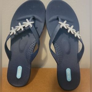 New navy sandals with cute starfish. Never worn. Size 9/European 39.